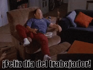 A Man Is Sitting On A Couch With A Shelf Full Of Cans Of Beer . GIF
