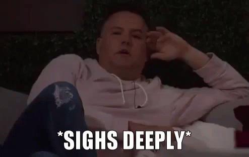 A Man Is Sitting On A Couch With His Hands On His Head And The Words `` Sighs Deeply '' Written Next To Him . GIF