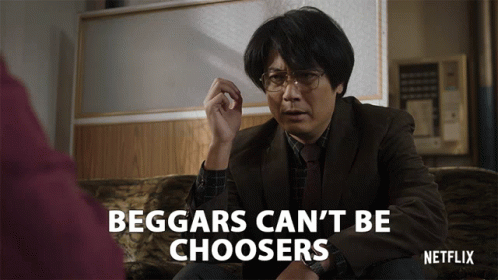 A Man Is Sitting On A Couch With The Words Beggars Can 'T Be Choosers On The Bottom GIF