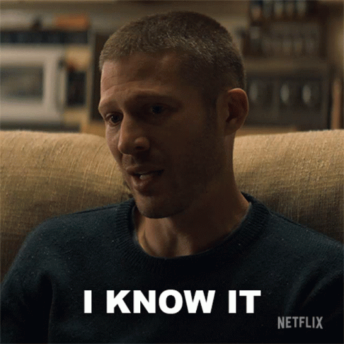 A Man Is Sitting On A Couch With The Words I Know It Written Below Him GIF