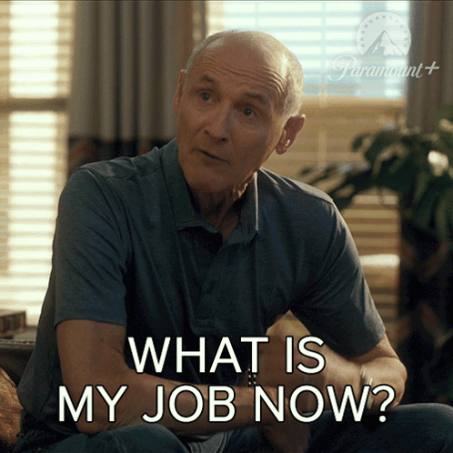 A Man Is Sitting On A Couch With The Words What Is My Job Now GIF