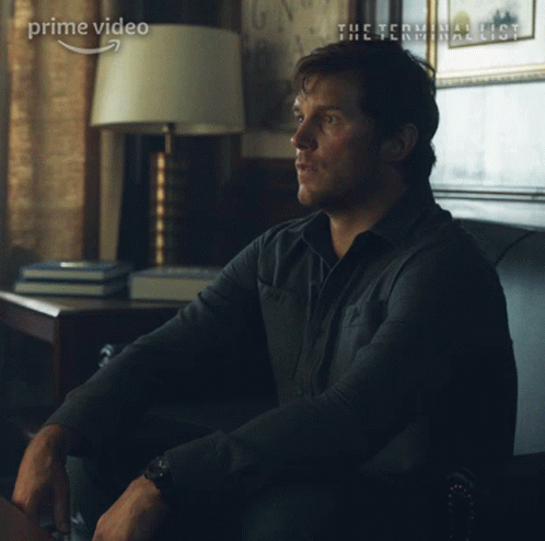 A Man Is Sitting On A Couch With The Words Yes Sir Written On His Face GIF