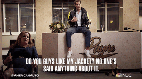 Man Sitting On Counter In Front Of Payne Logo GIF