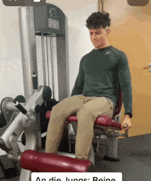 A Man Is Sitting On A Machine That Says An Die Lungs GIF