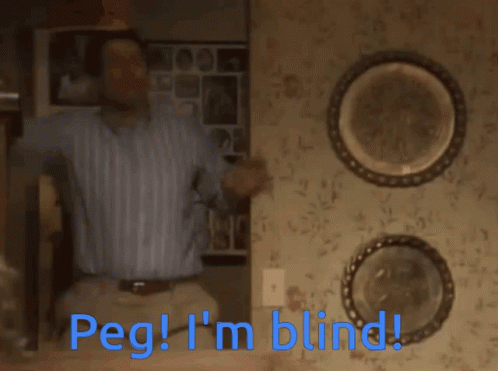 A Man Is Sitting On A Set Of Stairs With The Words Peg I 'M Blind Below Him GIF