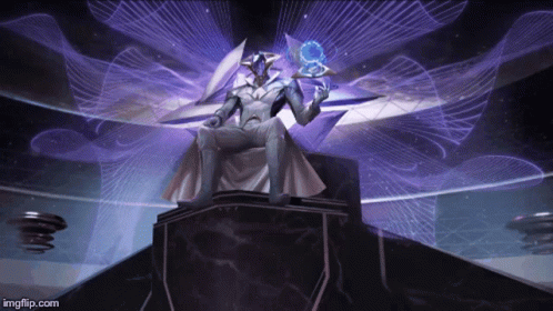 A Man Is Sitting On A Throne In A Room With Purple Lights Behind Him GIF