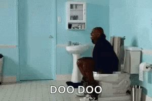 A Man Is Sitting On A Toilet In A Bathroom With The Words `` Doo Doo '' . GIF