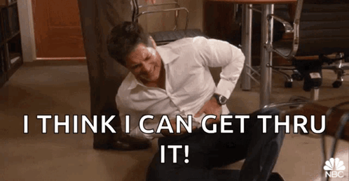 A Man Is Sitting On The Floor With His Hands On His Stomach And The Words `` I Think I Can Get Thru It '' GIF