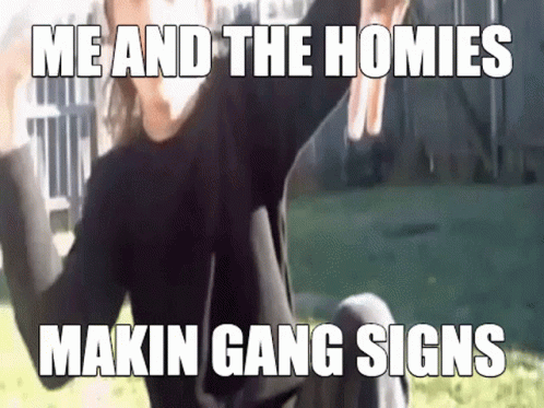 A Man Is Sitting On The Ground With His Arms In The Air And A Meme That Says Me And The Homies Makin Gang Signs GIF