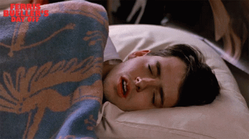 A Man Is Sleeping Under A Blanket With The Words Ferris Bueller 'S Day Off Written On The Bottom GIF