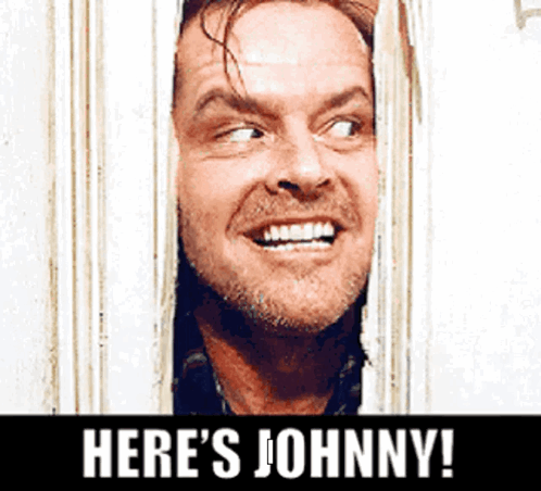 A Man Is Smiling And Looking Through A Window With The Words Here 'S Johnny Below Him GIF
