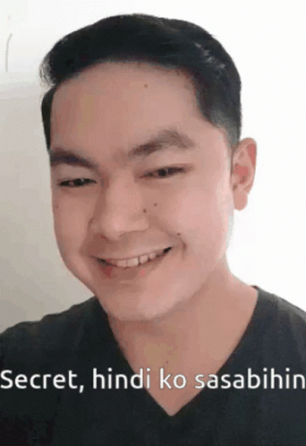 A Man Is Smiling And Making A Funny Face With The Words Secret , Hindi Ko Sasabihin . GIF