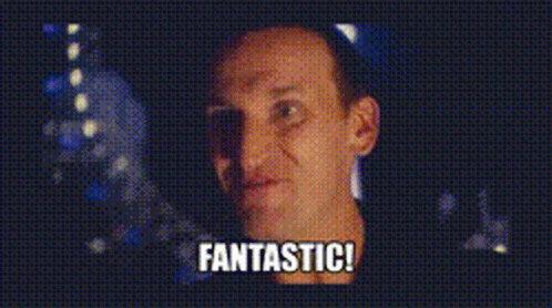 A Man Is Smiling And Says Fantastic In The Corner GIF