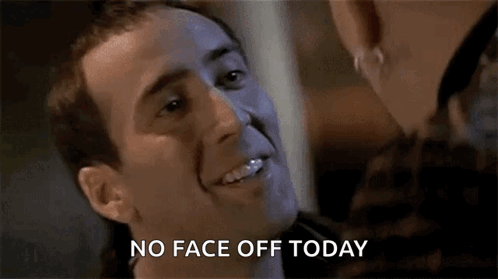 A Man Is Smiling And Talking To A Woman While Wearing A Mask And Says `` No Face Off Today '' . GIF