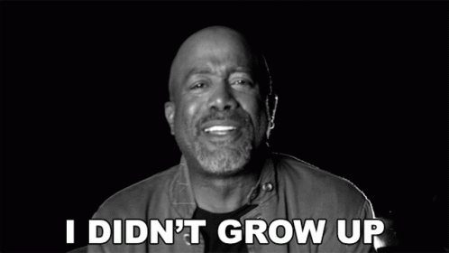 A Man Is Smiling In A Black And White Photo With The Words In A Castle Above Him GIF