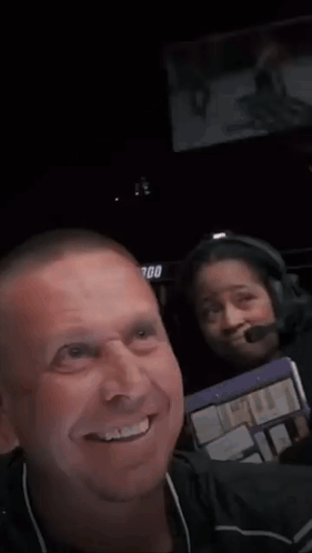 A Man Is Smiling In Front Of A Sign That Says Ufc 300 . GIF