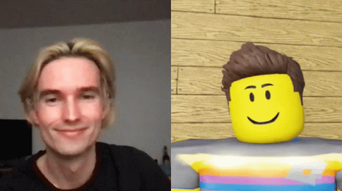 Man Smiling Next To Cartoon Character GIF