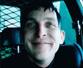 A Man Is Smiling While Sitting In A Car GIF