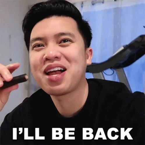 A Man Is Smiling With The Words " I 'Ll Be Back " Above Him GIF
