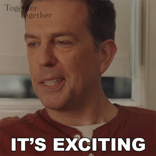 A Man Is Smiling With The Words It 'S Exciting Below Him GIF