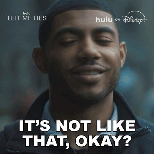 A Man Is Smiling With The Words " It 'S Not Like That Okay " Below Him GIF