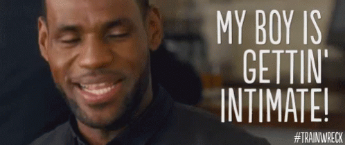 A Man Is Smiling With The Words " My Boy Is Gettin ' Intimate " On The Bottom GIF