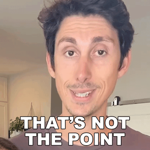 A Man Is Smiling With The Words That 'S Not The Point Above Him GIF