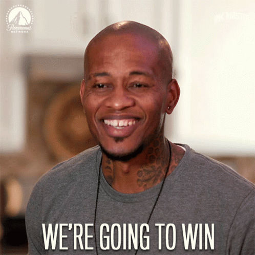 A Man Is Smiling With The Words " We 'Re Going To Win " Below Him GIF