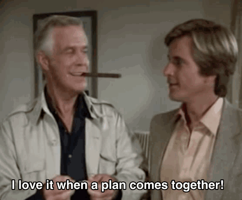 A Man Is Smoking A Cigar While Another Man Says `` I Love It When A Plan Comes Together '' . GIF