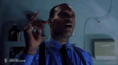 A Man Is Smoking A Cigarette And Saying `` I See You Soon !!! '' . GIF