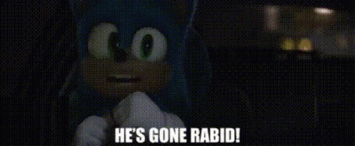 A Man Is Standing In A Dark Room And Says He 'S Gone Rabid GIF