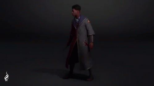 a man is standing in a dark room wearing a cape with a lion on it .