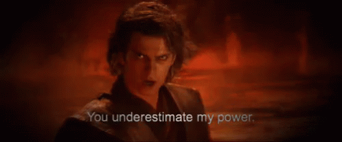 A Man Is Standing In A Dark Room With A Red Background And Says `` You Underestimate My Power . '' GIF