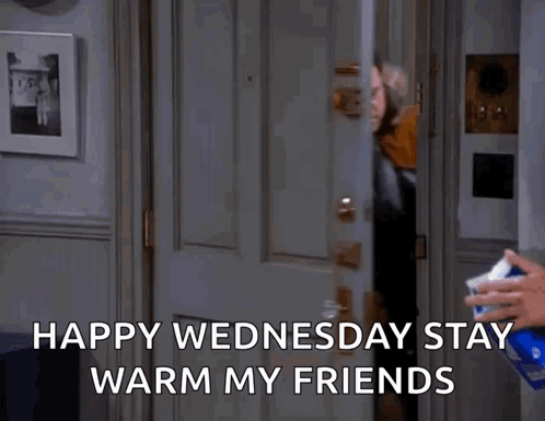 a man is standing in a doorway with the words happy wednesday stay warm my friends