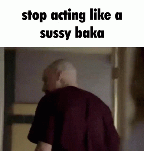 A Man Is Standing In A Doorway With The Words `` Stop Acting Like A Sussy Baka '' Written On The Bottom . GIF