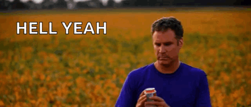 A Man Is Standing In A Field Holding A Can Of Soda And Says `` Hell Yeah '' . GIF
