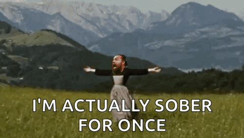 A Man Is Standing In A Field With His Arms Outstretched And The Words " I 'M Actually Sober For Once " GIF