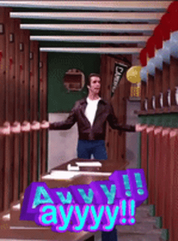 A Man Is Standing In A Room With A Sign That Says Ayyy ! GIF