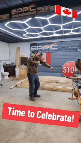 A Man Is Standing In A Room With A Stop Sign And A Sign That Says Time To Celebrate GIF