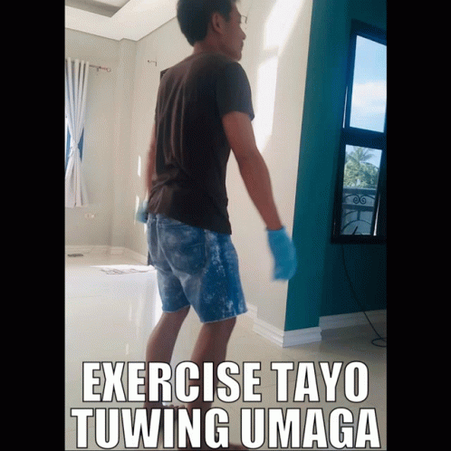 A Man Is Standing In A Room With The Words Exercise Tayo Tuwing Umaga GIF