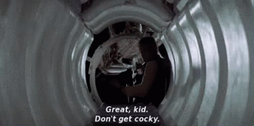A Man Is Standing In A Tunnel And Talking To A Woman . GIF