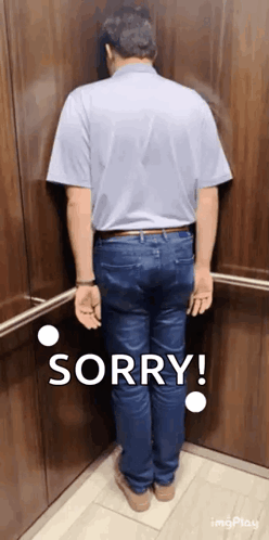 A Man Is Standing In An Elevator And Says Sorry GIF