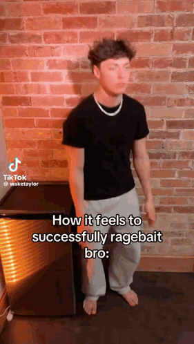 A Man Is Standing In Front Of A Brick Wall With His Eyes Closed And A Necklace Around His Neck . GIF