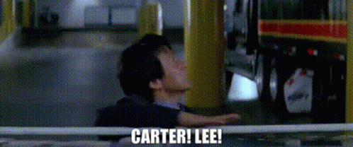 A Man Is Standing In Front Of A Bus With The Words Carter ! Lee ! Written On The Screen . GIF