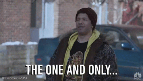 A Man Is Standing In Front Of A Car And Talking About The One And Only . GIF