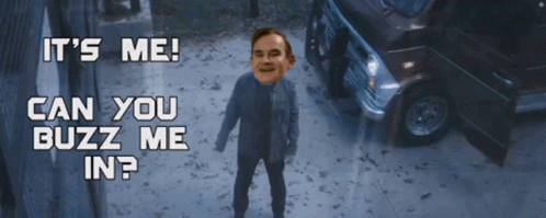 A Man Is Standing In Front Of A Car With The Words " It 'S Me Can You Buzz Me In " GIF
