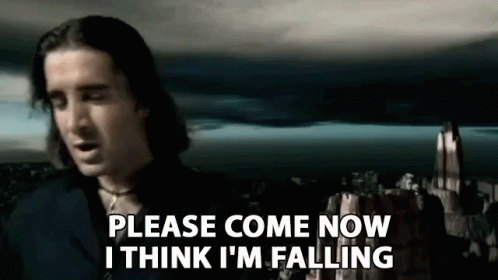 A Man Is Standing In Front Of A Castle And Saying `` Please Come Now I Think I 'M Falling '' GIF