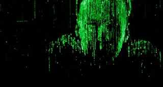 A Man Is Standing In Front Of A Computer Screen With Green Numbers On It . GIF