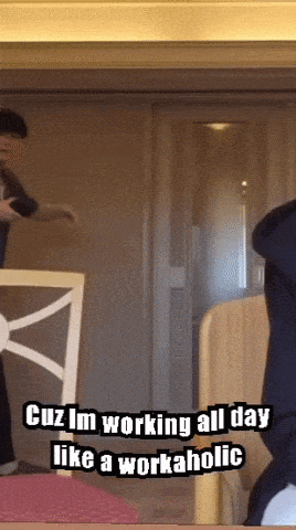 A Man Is Standing In Front Of A Door With The Words Cuz Im Working All Day Like A Workaholic GIF