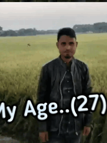 Man Standing In Field With Age 27 GIF